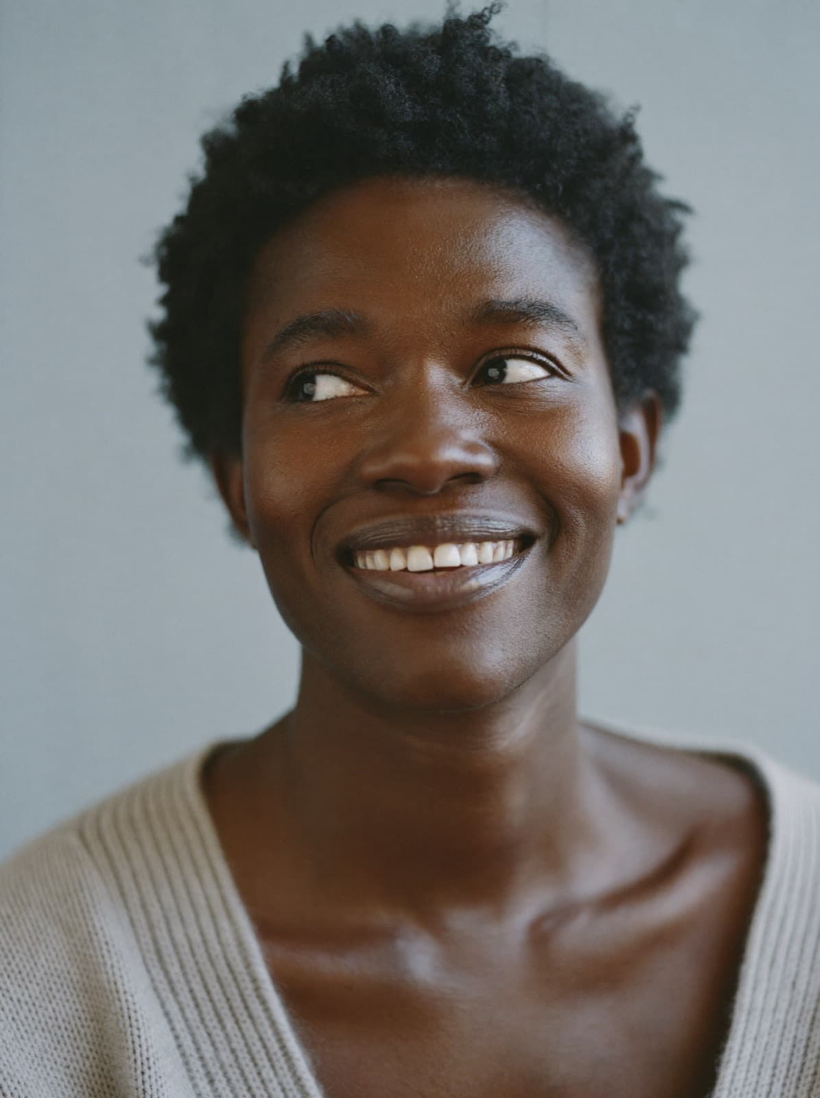 Portrait of a smiling woman with glowing skin